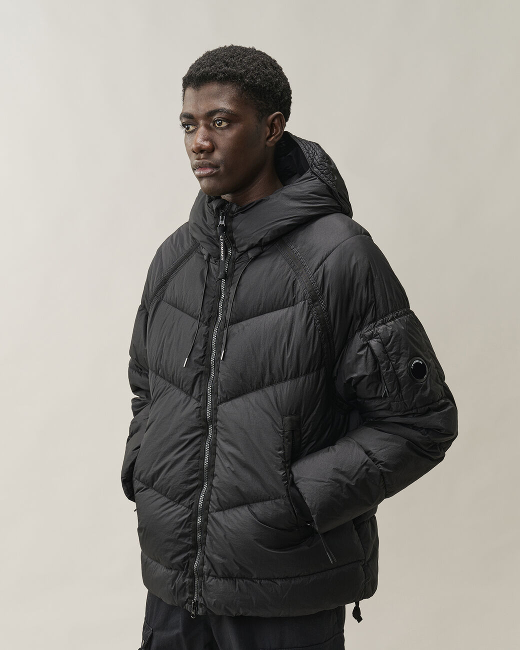 Piumino Down Shield Lens Hooded Puffer nero - YES SHOPGiubbottiC.P. COMPANY21CMOW210A/110655G-31521863710971