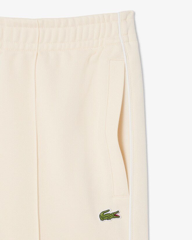 Pantaloni in tuta beige in piqué con bordo - YES SHOPPantaloni tutaLACOSTEXH0628-00-XXS7988189703771