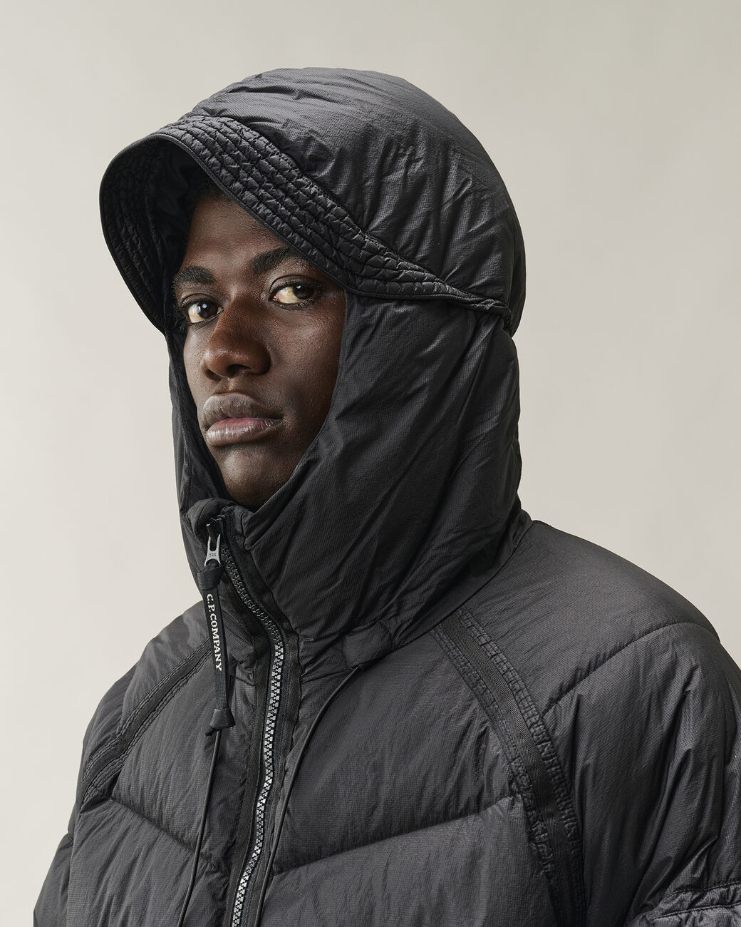 Piumino Down Shield Lens Hooded Puffer nero - YES SHOPGiubbottiC.P. COMPANY21CMOW210A/110655G-31521863710971