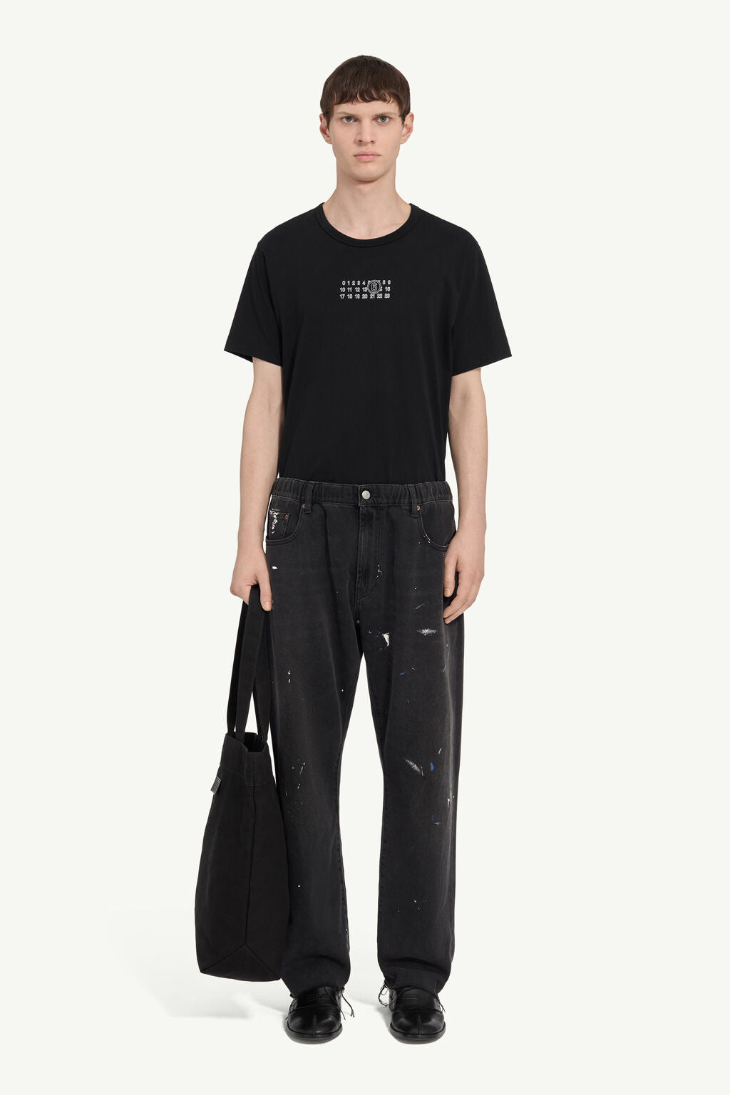 Jeans Nero Coulisse: Effetto Pittura e Design Artistico