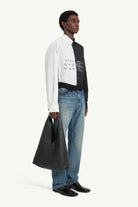 Jeans con vita ricostruita in nero - YES SHOPJeansMM6 MAISON MARGIELASH0LA0032M30055961-W253672305742771
