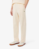 Pantaloni in tuta beige in piqué con bordo - YES SHOPPantaloni tutaLACOSTEXH0628-00-XXS7988189703771